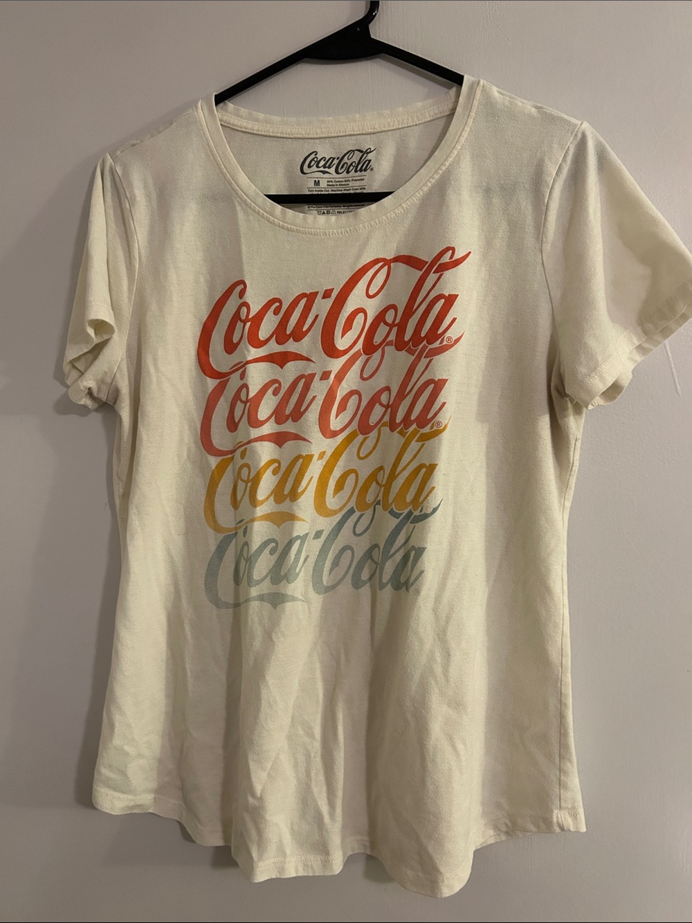Coca Cola Women's Cream Tee with Red, Orange, Yellow & Blue Gradient Logo